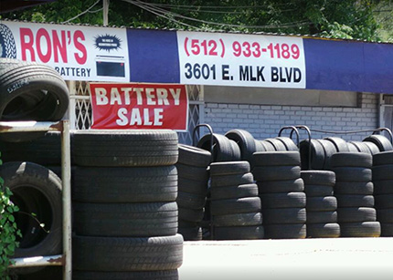 Ron's Tire and Battery Austin location with tires stacked